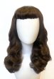 Brown 1950s pinup style wig, with long waves and a short fringe: Rosie Discount